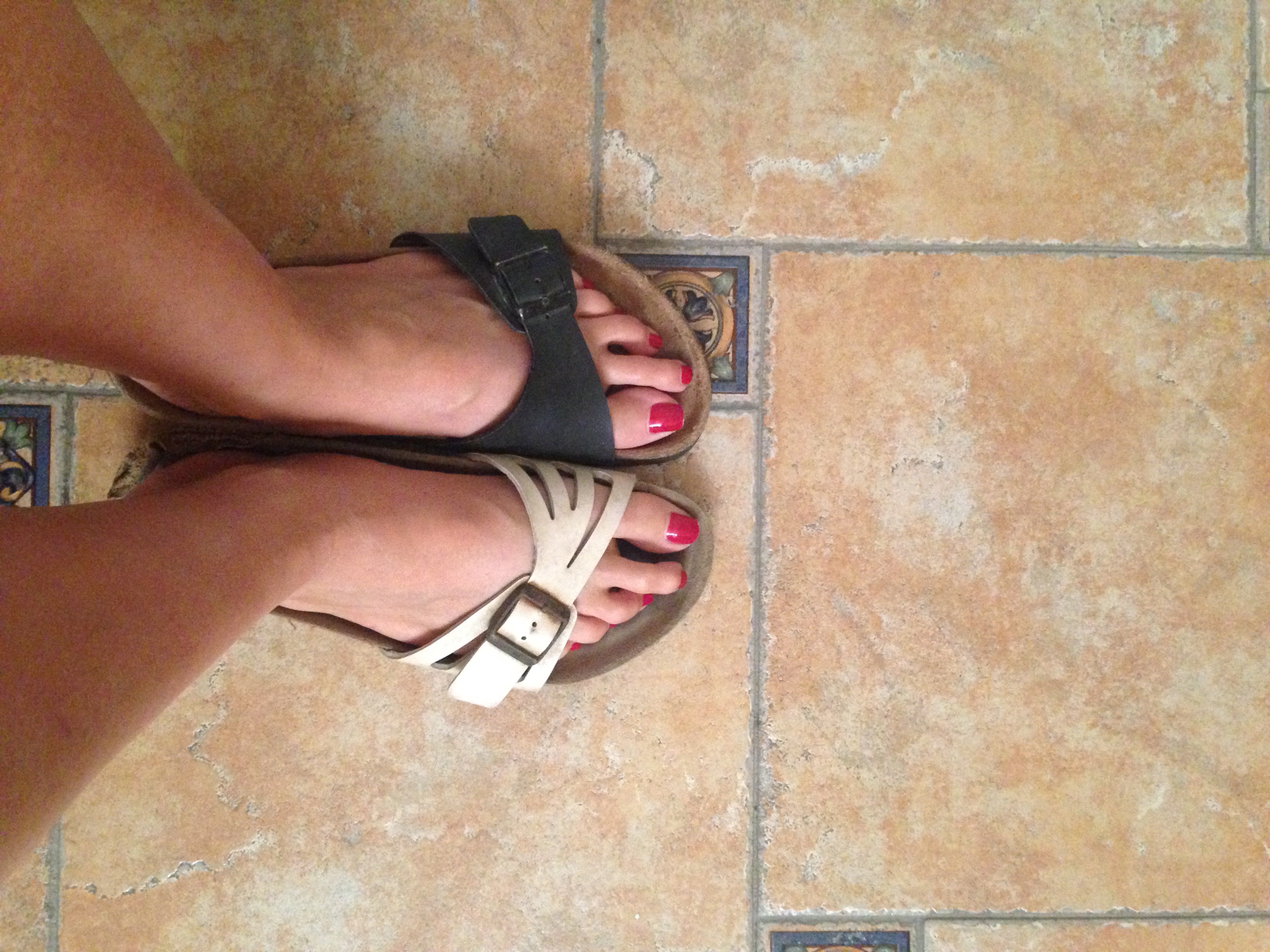 Mismatched sandals on holiday